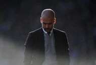 HUDDERSFIELD, ENGLAND - FEBRUARY 18: Josep Guardiola, Manager of Manchester City looks dejected during The Emirates FA Cup Fifth Round match between Huddersfield Town and Manchester City at John Smith's Stadium on February 18, 2017 in Huddersfield, England.  (Photo by Gareth Copley/Getty Images)